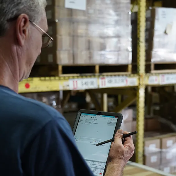 Man taking inventory with tablet