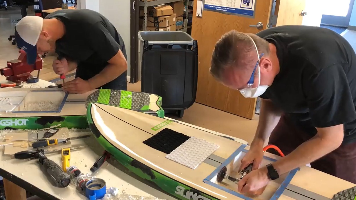 Men working on watercraft