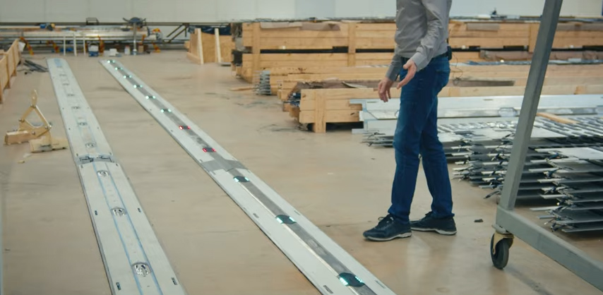 Man walking by the Elonroad charging strips