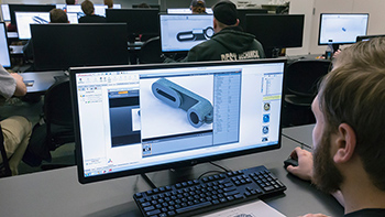 Person in class with 3D rendering on screen - SOLIDWORKS