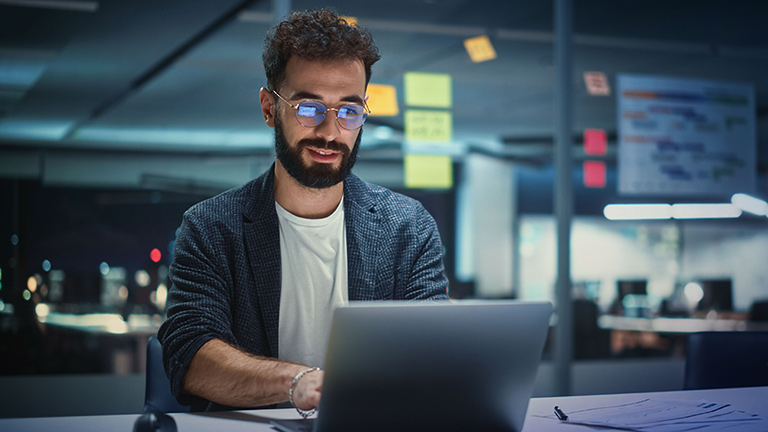 Person working on laptop in office