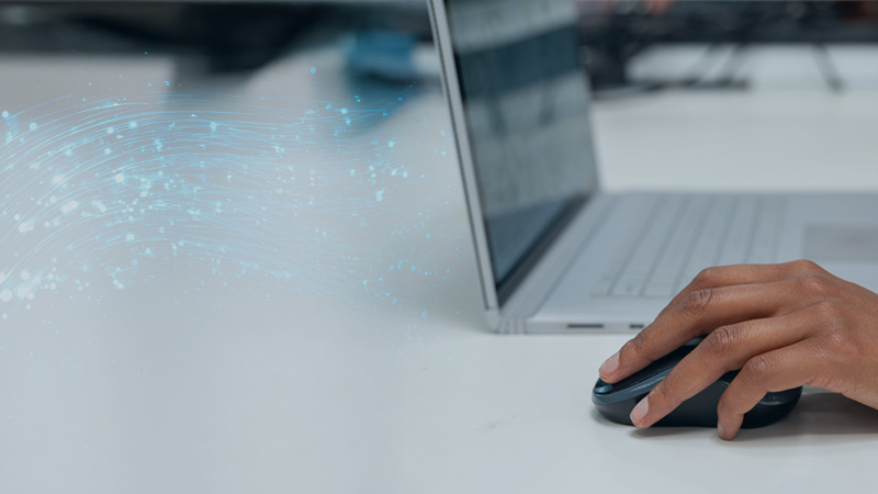 A laptop, a human hand, and design showing technological information