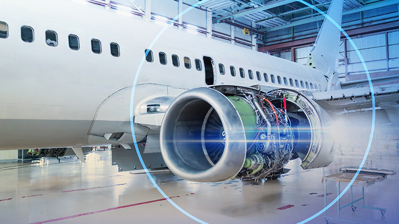 Photo of airplane with focus on jet engine
