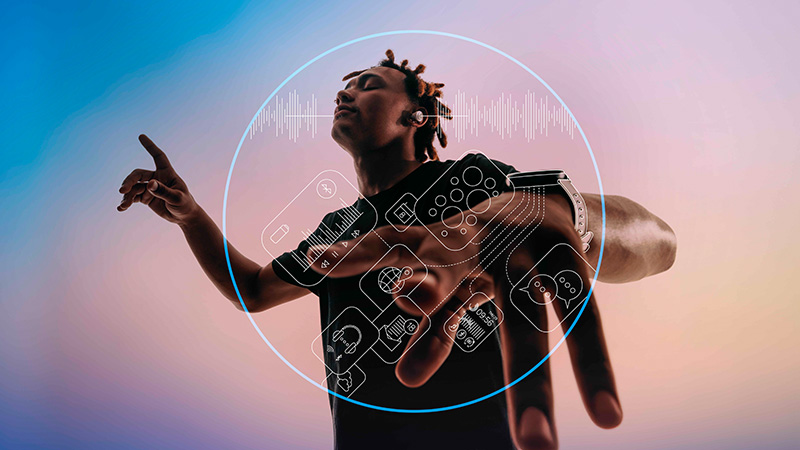 Young man wearing earbud headphones and dancing to music