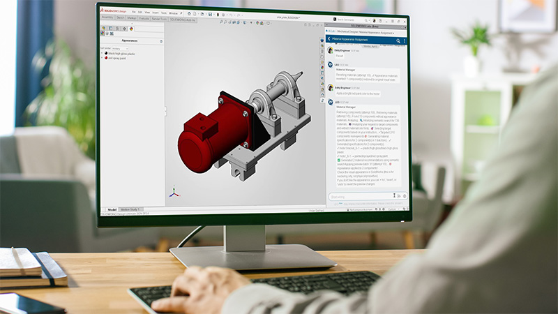 mechanical design engineer utilizing SOLIDWORKS Design software on a desktop computer