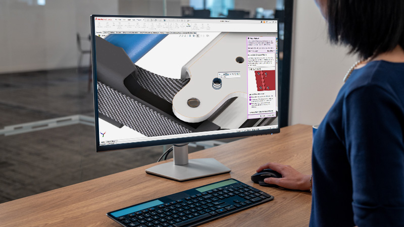 woman using SOLIDWORKS Design software on a desktop monitor