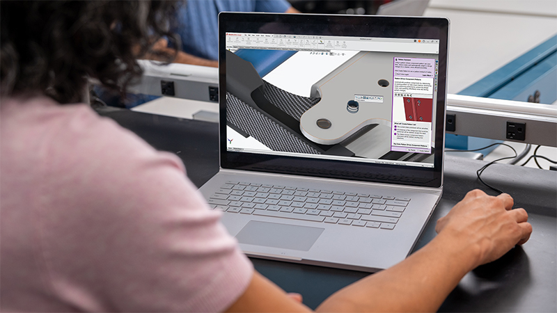woman using SOLIDWORKS Design software on a portable laptop computer