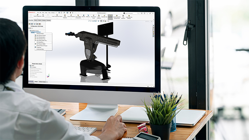 Designer working on SOLIDWORKS 3D model of exercise equipment