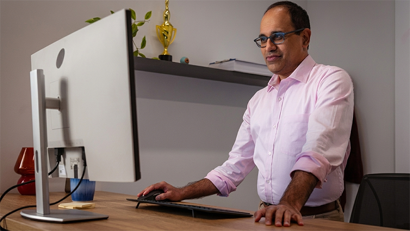 engineer or engineering manager using a desktop computer in an office