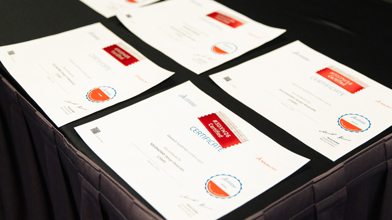 SOLIDWORKS professional certificates laying on a table