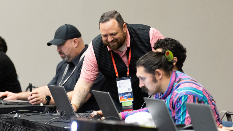 SOLIDWORKS instructor helping a session participant with software