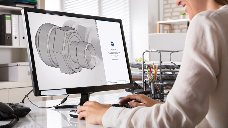 Designer using SOLIDWORKS in office setting