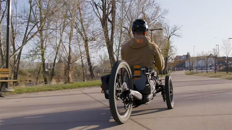 Person riding away on Bowhead adaptive e-bike - SOLIDWORKS