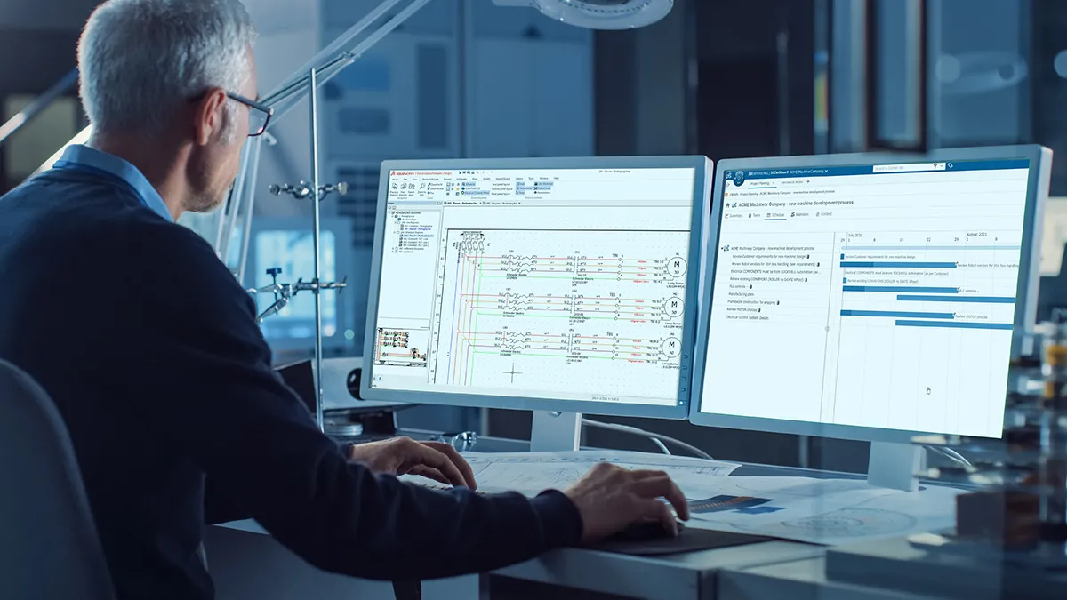Person at monitors showing user interface for Electrical Schematic Designer - SOLIDWORKS