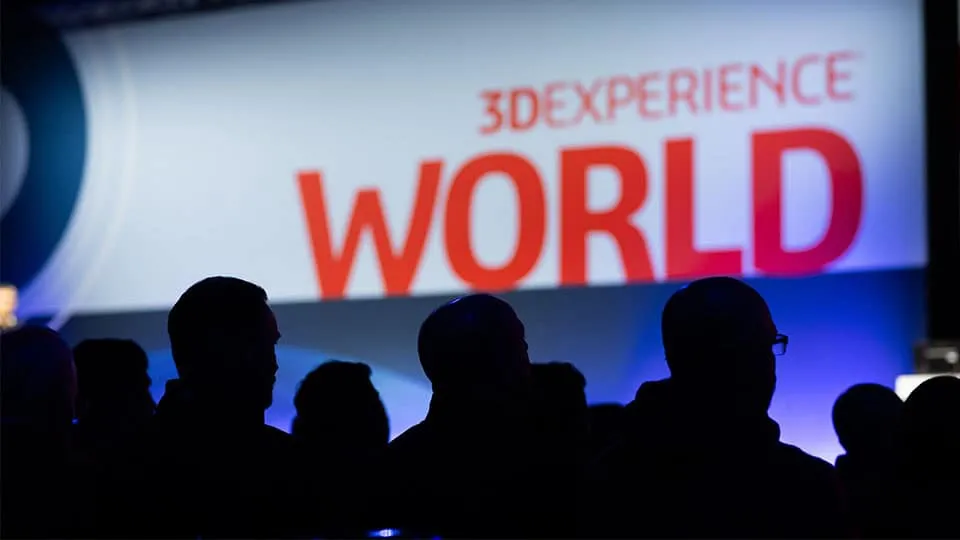 3DEXPERIENCE World 2025 attendees with an event screen behind them