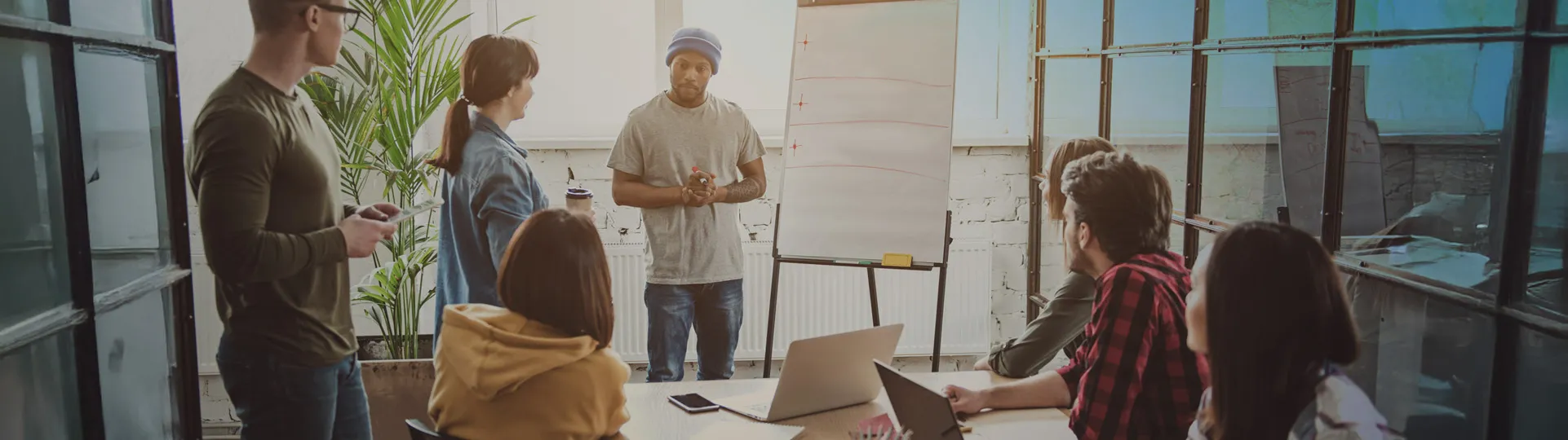 Small team of employees discussing a project