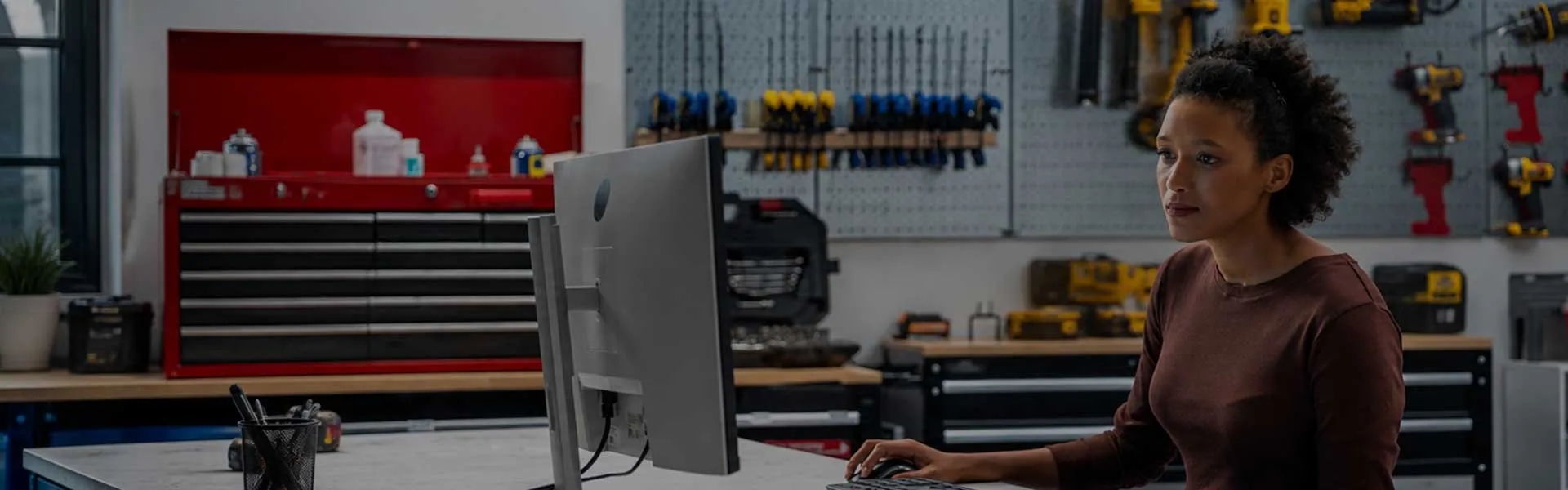 image depicting woman using a desktop computer