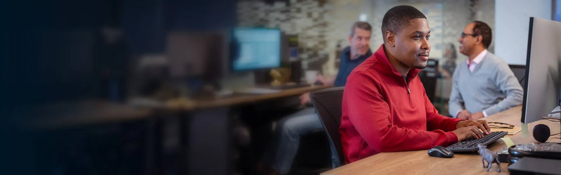 Designer working at computer in office setting