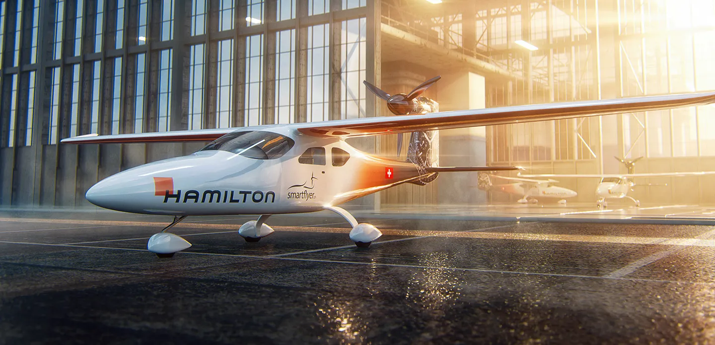 Smartflyer plane in front of hanger