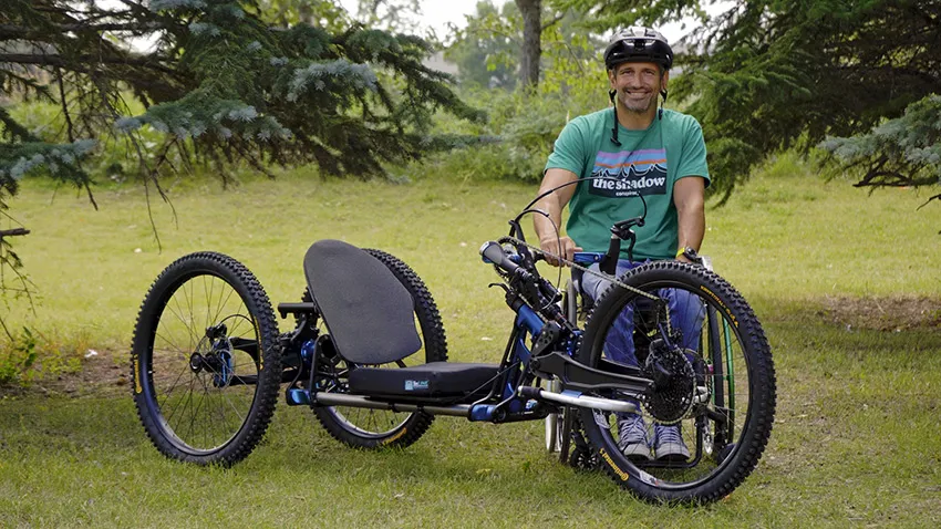Person in wheelchair next to Bowhead all terrain wheelchair - SOLIDWORKS Cloud Services