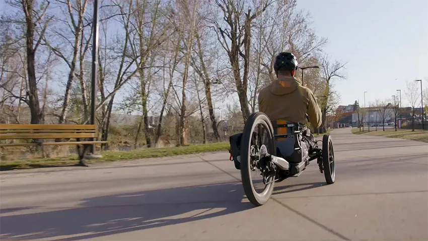 Person riding away in Bowhead adaptive e-bike - SOLIDWORKS
